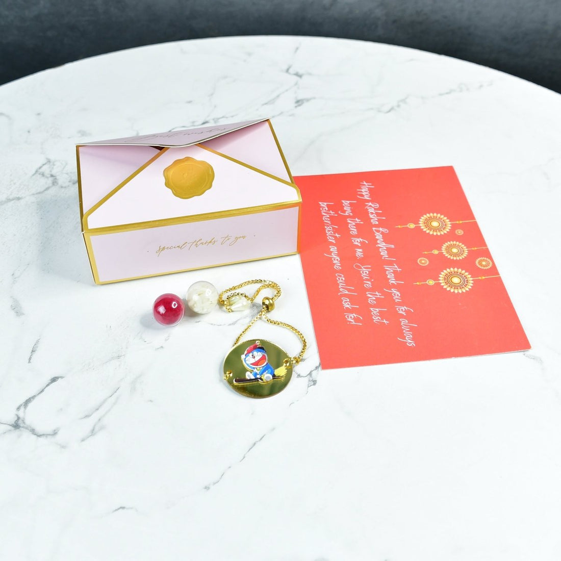 Sowpeace Exquisite Doraemon Rakhi Pack of 1 with Roli Chawal and Greeting card combo for Raksha Bandhan and Gifting - Sowpeace - 