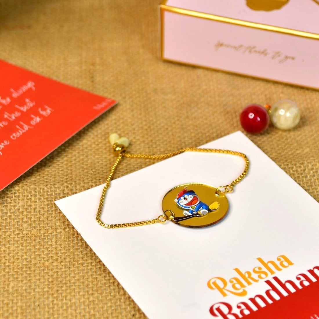 Sowpeace Exquisite Doraemon Rakhi Pack of 1 with Roli Chawal and Greeting card combo for Raksha Bandhan and Gifting - Sowpeace - 