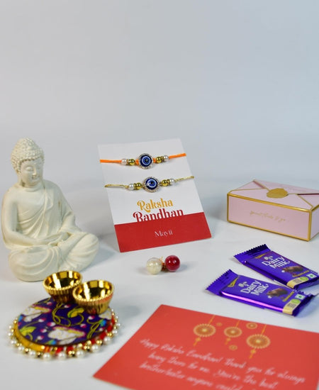 Sowpeace Exquisite Evil Eye Rakhi Pack of 1 with Roli Chawal Thali, Chocolates, Buddha and Greeting card combo for Raksha Bandhan and Gifting