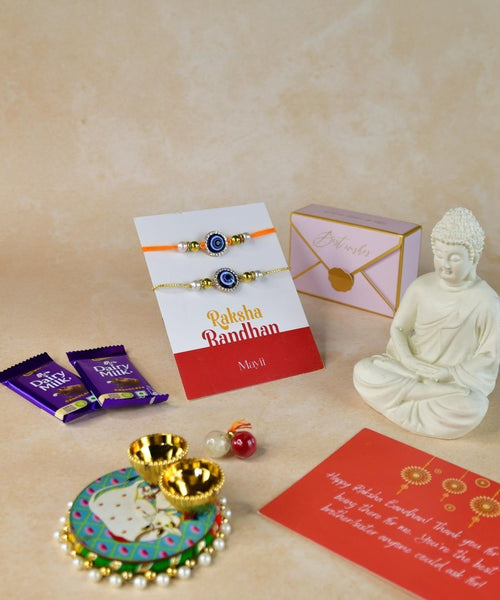 Sowpeace Exquisite Evil Eye Rakhi Pack of 1 with Roli Chawal Thali, Chocolates, Buddha and Greeting card combo for Raksha Bandhan and Gifting
