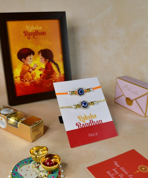 Sowpeace Exquisite Evil Eye Rakhi Pack of 1 with Roli Chawal Thali, Chocolates, Photo Frame and Greeting card combo for Raksha Bandhan and Gifting