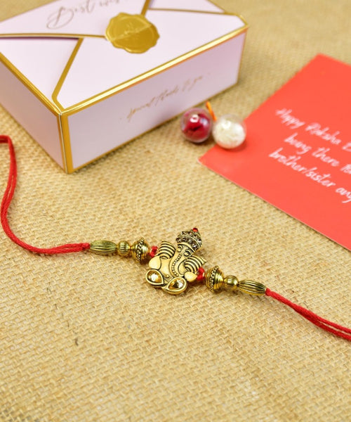 Sowpeace Exquisite Golden Ganesha Rakhi Pack of 1 with Roli Chawal and Greeting card combo for Raksha Bandhan and Gifting