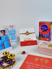 Sowpeace Exquisite Golden Ganesha Rakhi Pack of 1 with Roli Chawal Thali, Chocolates, Poloroids and Greeting card combo for Raksha Bandhan and Gifting - Additional View