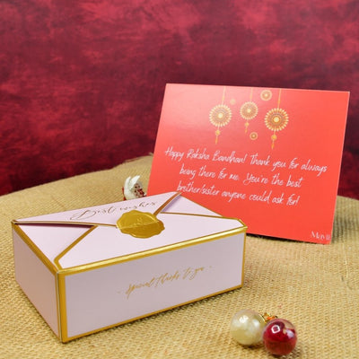 Sowpeace Exquisite Golden Ganesha Rakhi Pack of 1 with Roli Chawal Thali, two Chocolates, and Greeting card combo for Raksha Bandhan and Gifting