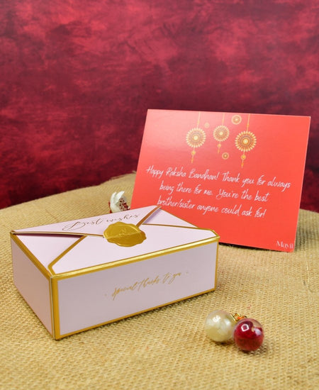 Sowpeace Exquisite Golden Ganesha Rakhi Pack of 1 with Roli Chawal Thali, two Chocolates, and Greeting card combo for Raksha Bandhan and Gifting