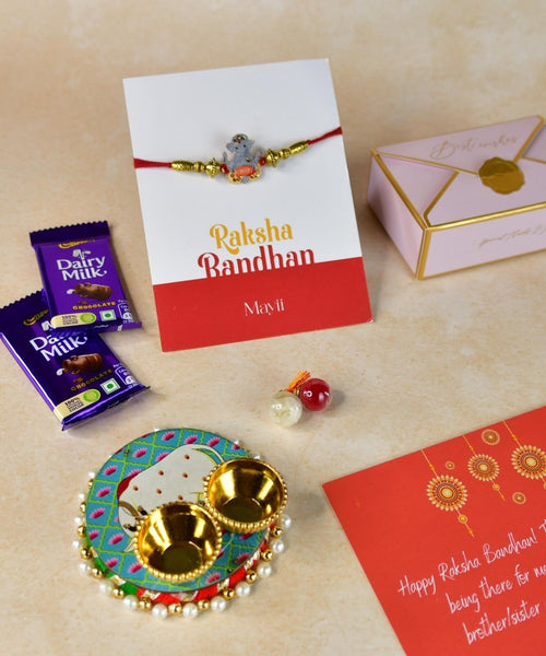 Sowpeace Exquisite Green Ganesha Rakhi Pack of 1 with Roli Chawal Thali, Chocolates, and Greeting card combo for Raksha Bandhan and Gifting