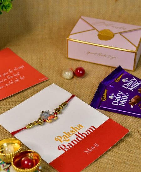 Sowpeace Exquisite Green Ganesha Rakhi Pack of 1 with Roli Chawal Thali, Chocolates, and Greeting card combo for Raksha Bandhan and Gifting