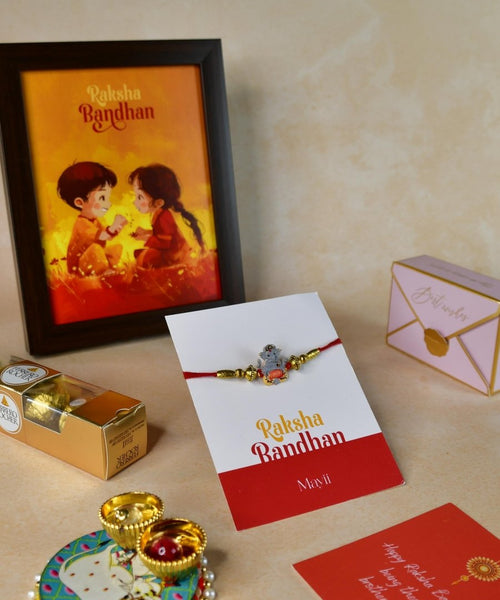 Sowpeace Exquisite Green Ganesha Rakhi Pack of 1 with Roli Chawal Thali, Chocolates, Photo Frame and Greeting card combo for Raksha Bandhan and Gifting