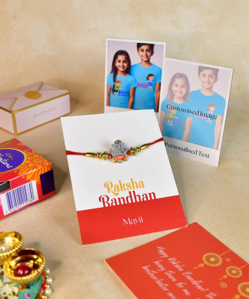 Sowpeace Exquisite Green Ganesha Rakhi Pack of 1 with Roli Chawal Thali, Chocolates, Poloroids and Greeting card combo for Raksha Bandhan and Gifting