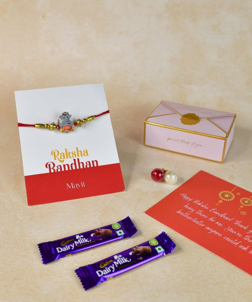 Sowpeace Exquisite Green Ganesha Rakhi Pack of 1 with Roli Chawal Thali, two Chocolates, and Greeting card combo for Raksha Bandhan and Gifting