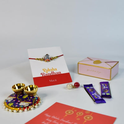 Sowpeace Exquisite Green Ganesha Rakhi Pack of 1 with Roli Chawal Thali, two Chocolates, and Greeting card combo for Raksha Bandhan and Gifting