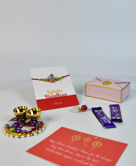 Sowpeace Exquisite Green Ganesha Rakhi Pack of 1 with Roli Chawal Thali, two Chocolates, and Greeting card combo for Raksha Bandhan and Gifting