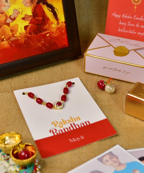 Sowpeace Exquisite Red Beads Rakhi Pack of 1 with Roli Chawal Thali, Chocolates, Photo Frame, Poloroids and Greeting card combo for Raksha Bandhan and Gifting