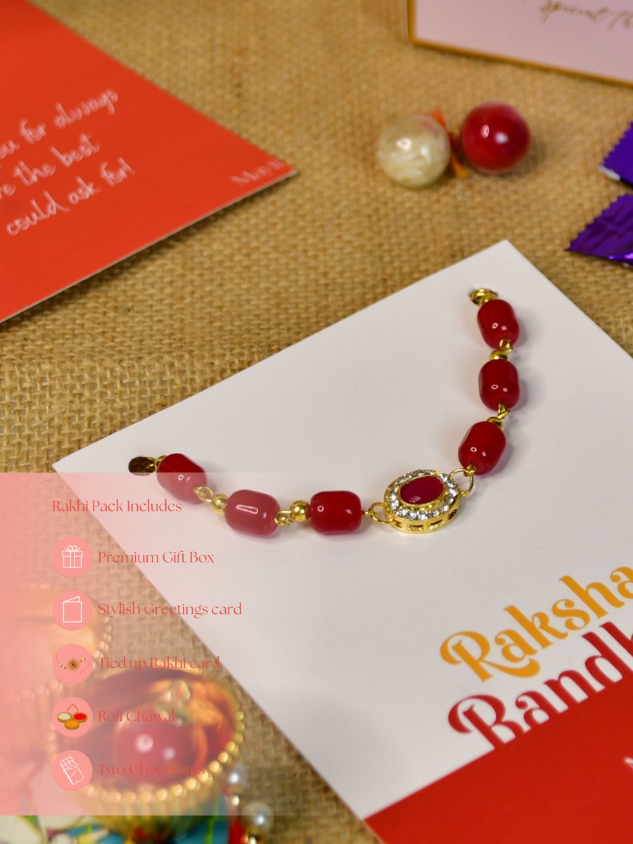 Sowpeace Exquisite Red Beads Rakhi Pack of 1 with Roli Chawal Thali, two Chocolates, and Greeting card combo for Raksha Bandhan and Gifting - Rakhi - Sowpeace - Sowpeace Exquisite Red Beads Rakhi Pack of 1 with Roli Chawal Thali, two Chocolates, and Greeting card combo for Raksha Bandhan and Gifting - RAK - REDBD - HND - P2 - Sowpeace