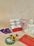 Sowpeace Exquisite Red Centre Flower Rakhi Pack of 1 with Roli Chawal Thali, Chocolates, Photo Frame and Greeting card combo for Raksha Bandhan and Gifting - Rakhi - Sowpeace - Sowpeace Exquisite Red Centre Flower Rakhi Pack of 1 with Roli Chawal Thali, Chocolates, Photo Frame and Greeting card combo for Raksha Bandhan and Gifting - RAK - CRFL - HND - P6 - Sowpeace