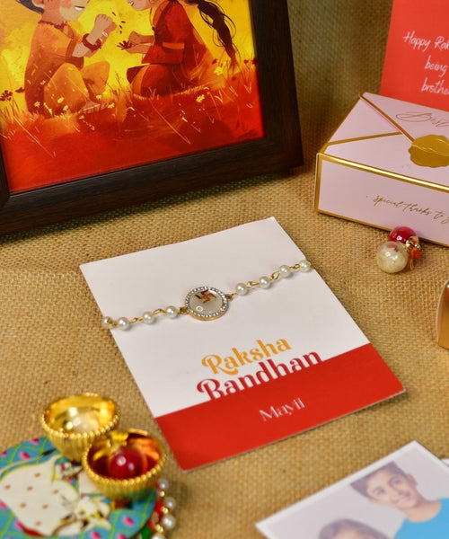 Sowpeace Exquisite Swastik Rakhi Pack of 1 with Roli Chawal Thali, Chocolates, Photo Frame, Poloroids and Greeting card combo for Raksha Bandhan and Gifting