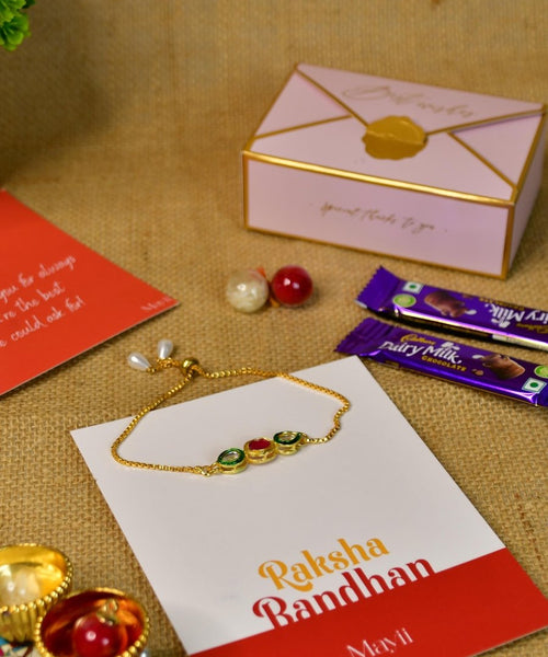 Sowpeace Exquisite Tri Red Green Rakhi Pack of 1 with Roli Chawal Thali, two Chocolates, and Greeting card combo for Raksha Bandhan and Gifting